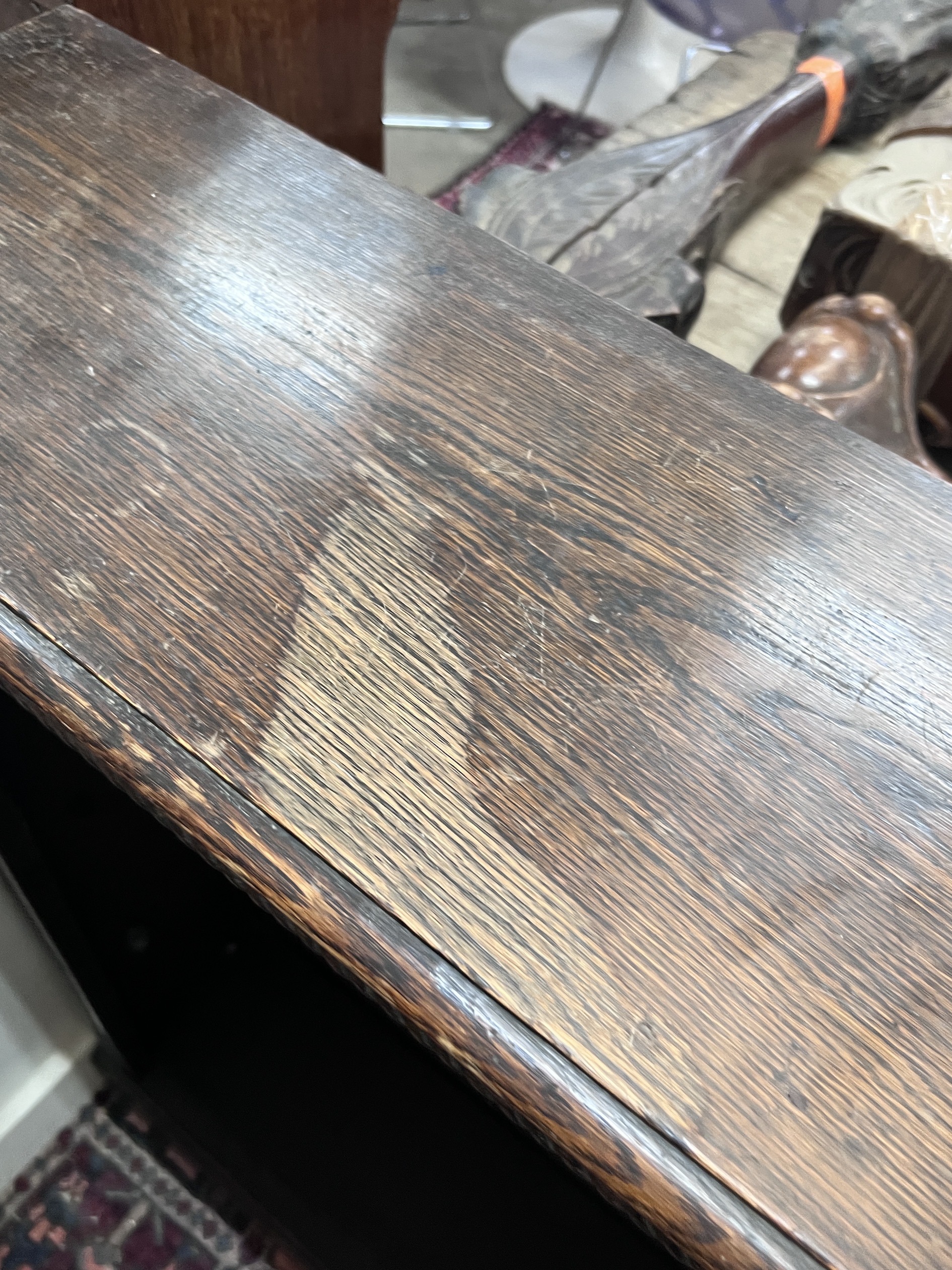 An early 20th century oak open bookcase, length 99cm, depth 25cm, height 107cm